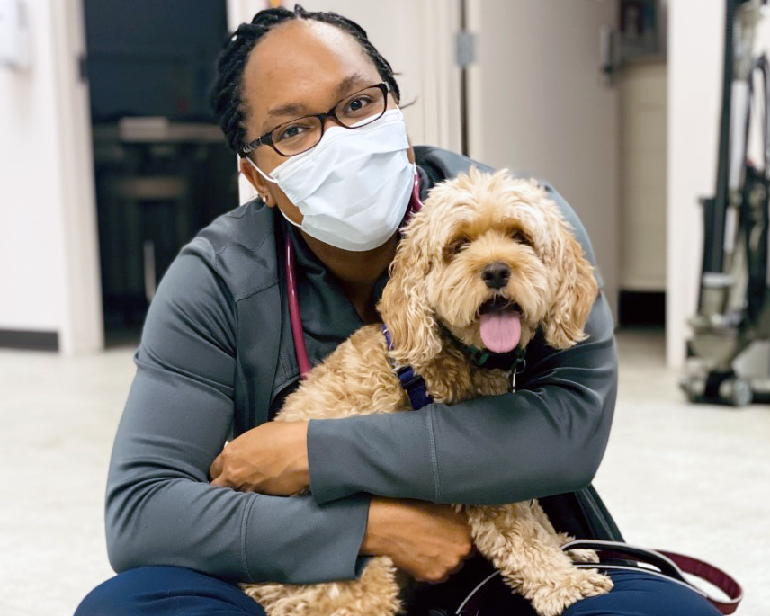 Dr. Amber Slaughter holding a patient named Ginger.