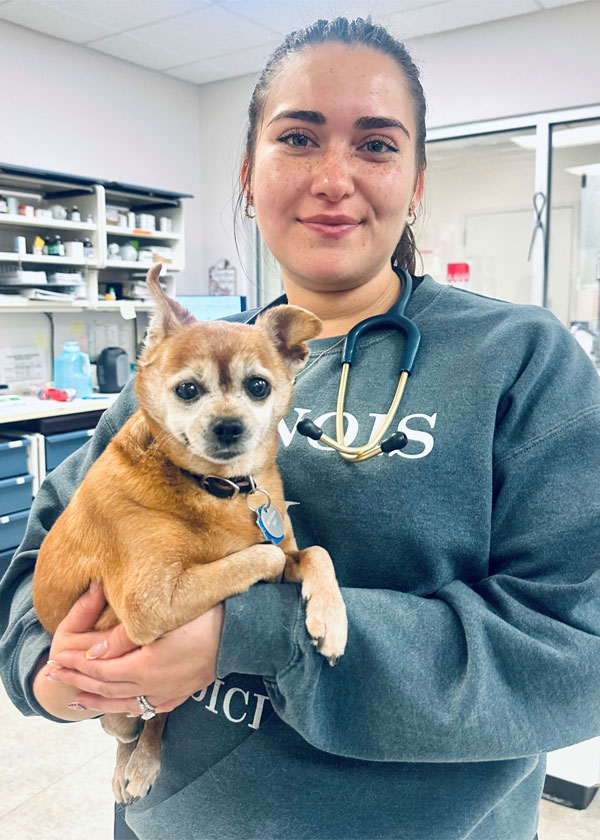 Dr. Calderón holding a dog